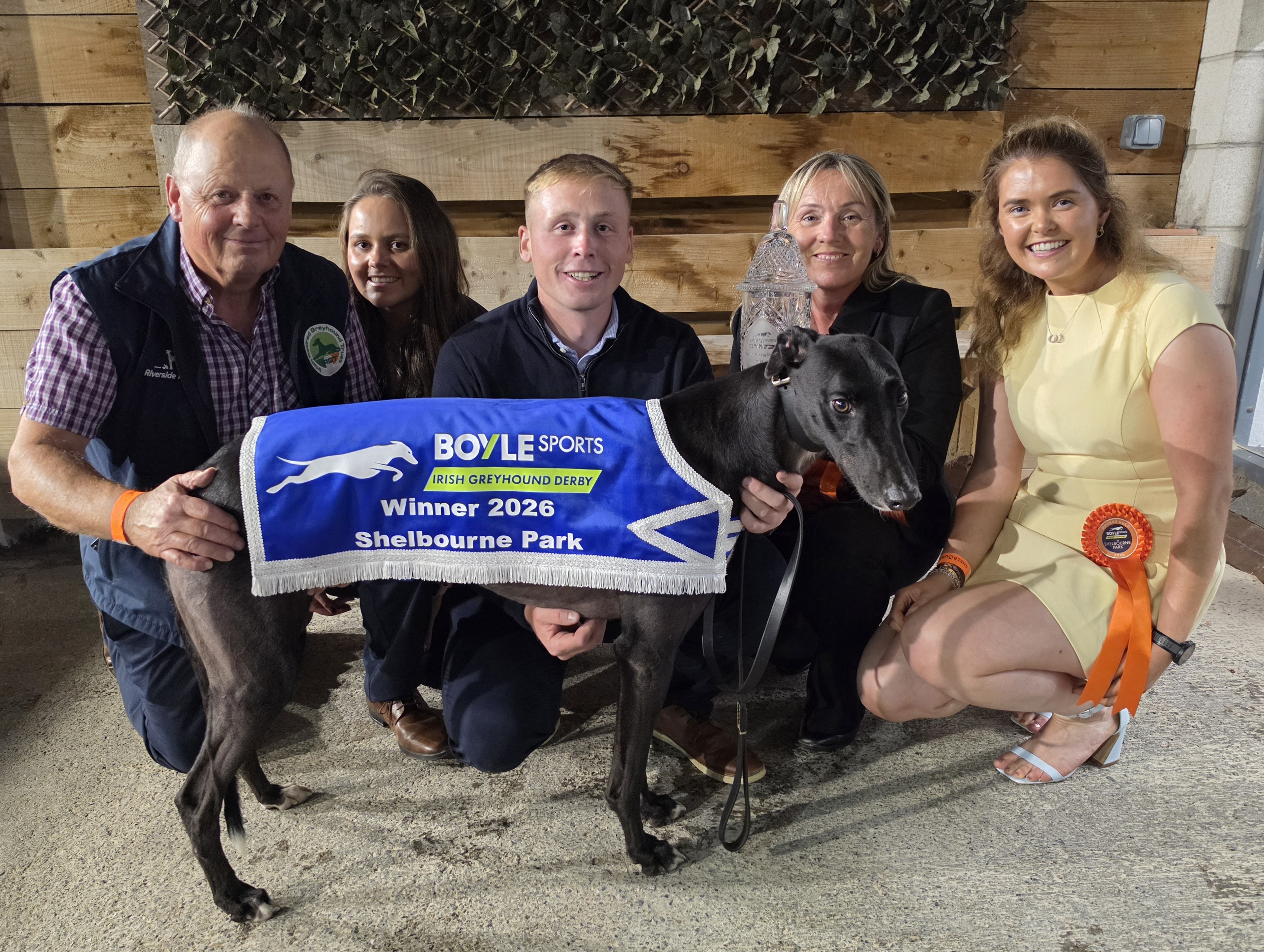 The Holland family celebrate with their record breaking sixth BOYLE Sports Irish Greyhound Derby champion, Bockos Gold. Image shows the Holland family celebrate with their record breaking sixth BOYLE Sports Irish Greyhound Derby champion, Bockos Gold. L-R Trainer Graham Holland, daughter Rachel, son Timmy, wife Nicky and Timmy's partner Sheena Murphy.
