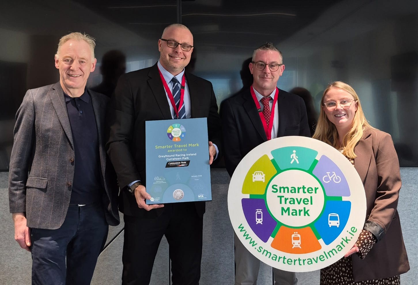 TFI staff pictured with Adam Smietanski, Hospitality & Facilities Manager, and Thomas Ryan, Events & Sponsorships Manager, following the presentation of the Smarter Travel Mark to Greyhound Racing Ireland at Curraheen Park.  