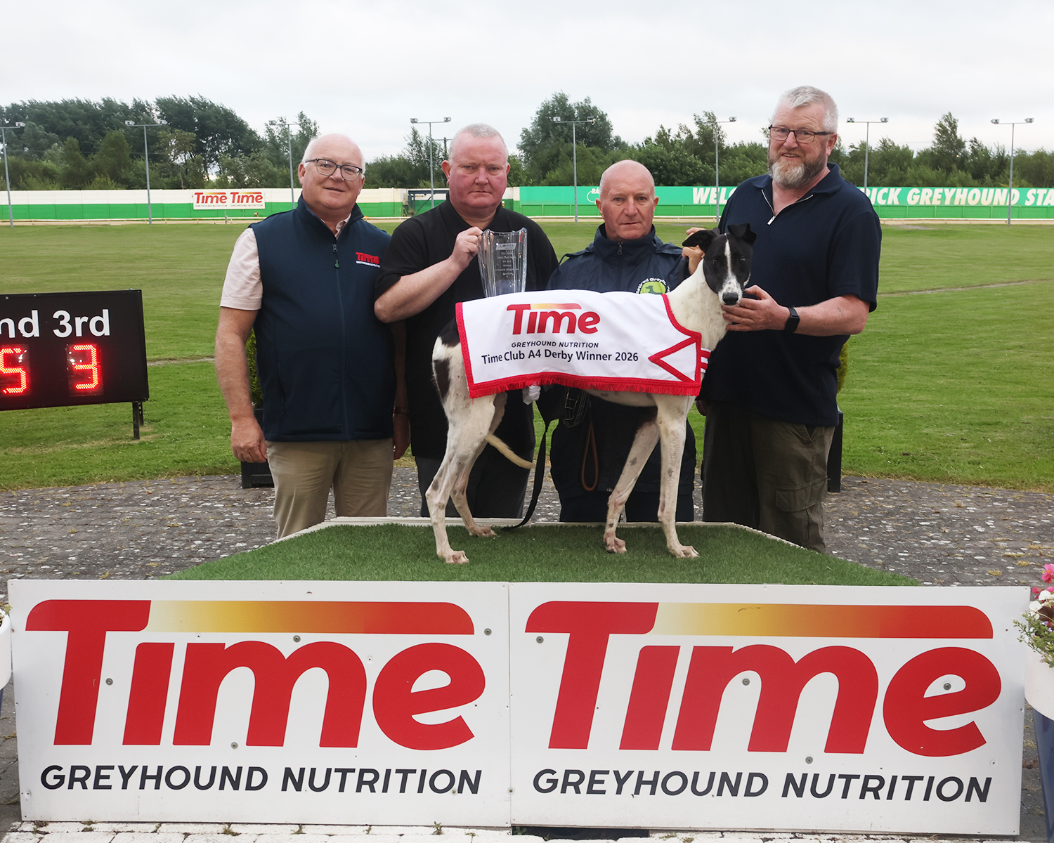 Image shows Willie Rigney presents Kevin, Alan and Donagh McLean after Kerryroad Al won the  2026 Time Club Derby Final