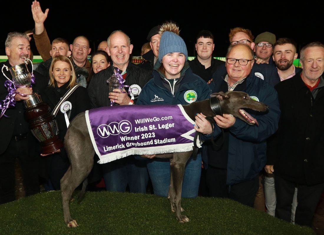 Image shows a closer shot of part of a large group of people at the winner's podium of Limerick Greyhound Stadium for the presentation by WillWeGo.com's Ray Quinn to winning owners James and Muireann Murphy, trainer Graham Holland, Breeder Jerry Murphy and winning greyhound Clonbrien Treaty. The group includes a number of people including the Mayor of Limerick and TD's and Councillors and connections of the 2023 WillWeGo.com Irish St Leger Final Image shows a closer shot of part of a large group of people at the winner's podium of Limerick Greyhound Stadium for the presentation by WillWeGo.com's Ray Quinn to winning owners James and Muireann Murphy, trainer Graham Holland, Breeder Jerry Murphy and winning greyhound Clonbrien Treaty. The group includes a number of people including the Mayor of Limerick and TD's and Councillors and connections of the 2023 WillWeGo.com Irish St Leger Final